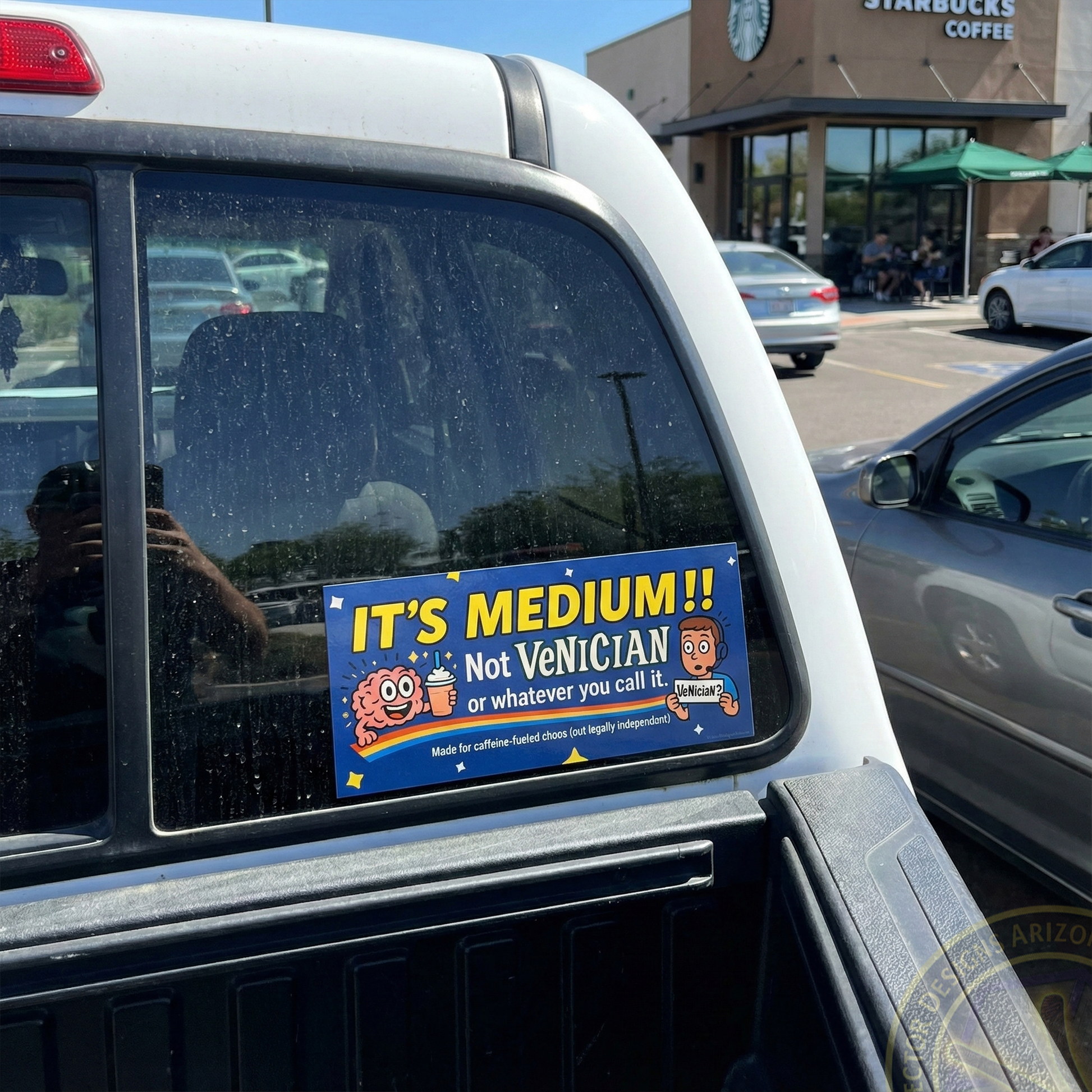 Coffee humor bumper sticker reading “It’s Medium!! Not Venician” on truck in parking. lot. 