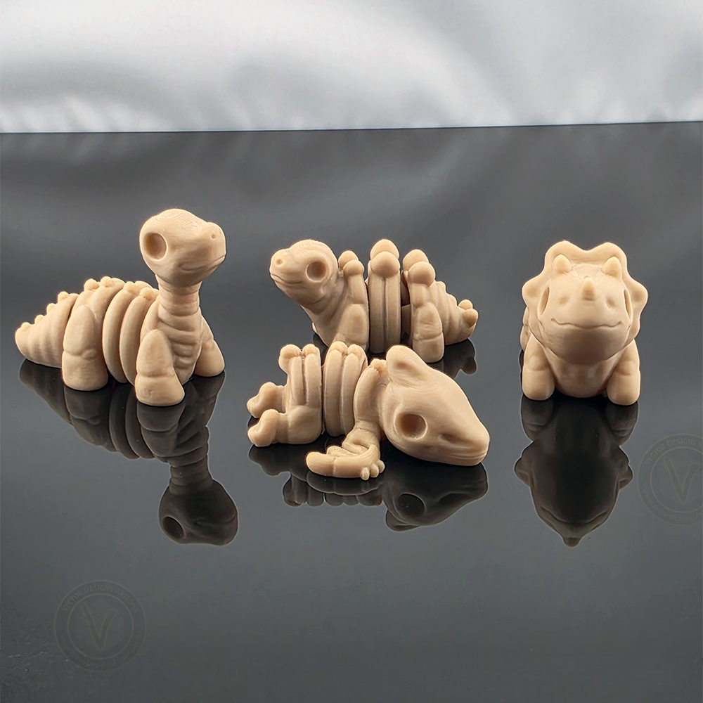 Four tan mini flexy skeleton dinosaur toys posed together on reflective black surface.