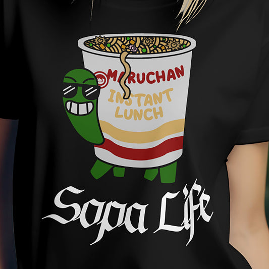Person wearing black ramen turtle Sopa Life T-shirt with cartoon noodle cup design.