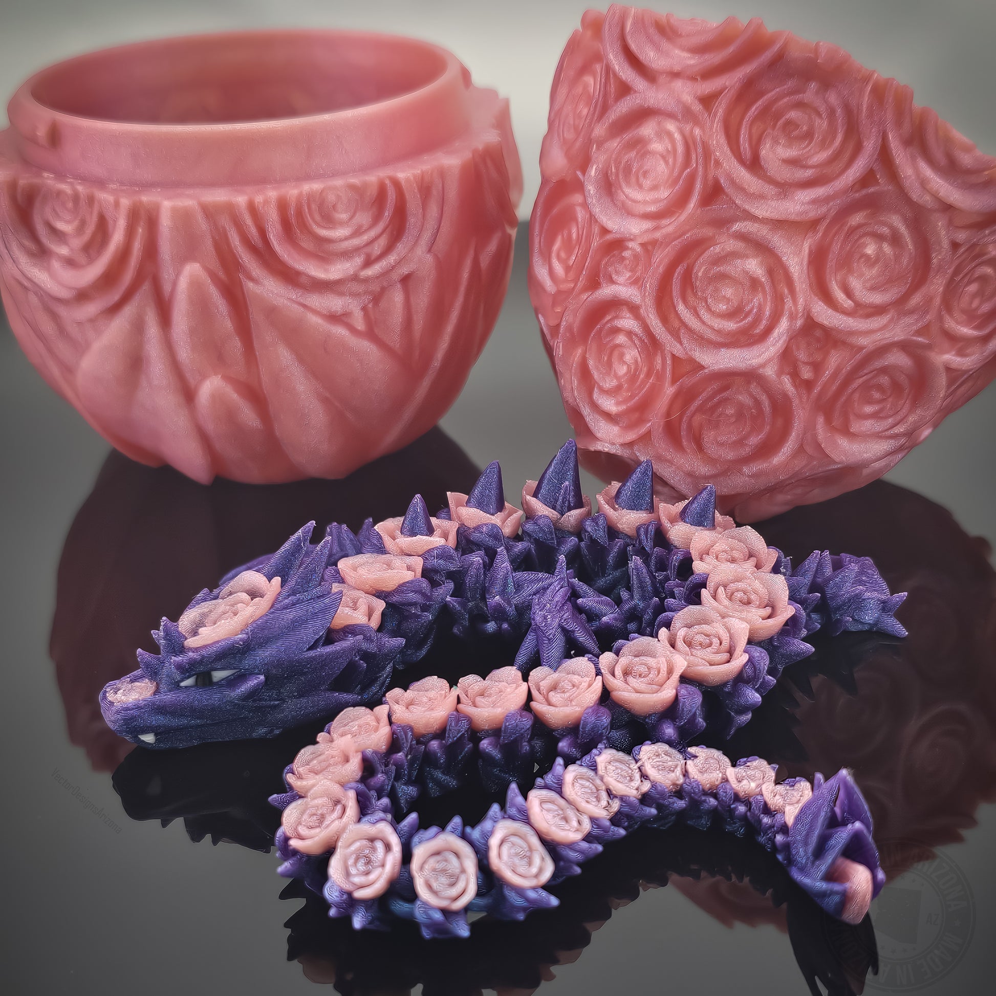 Purple rose dragon flexi figurine with matching pink rose egg on glossy black surface.