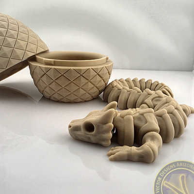 Flexy skeleton dragon lying in front of open textured egg on glossy surface.