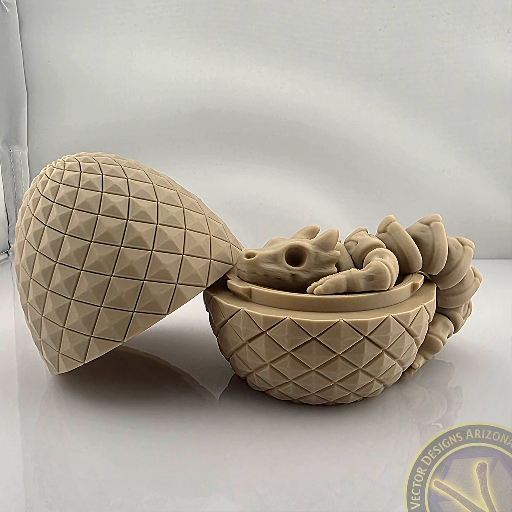 Flexy skeleton dragon curled inside textured egg shell on light backdrop.