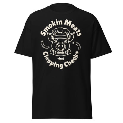 Black Smokin Meats pig chef barbecue T-shirt displayed on plain white background.