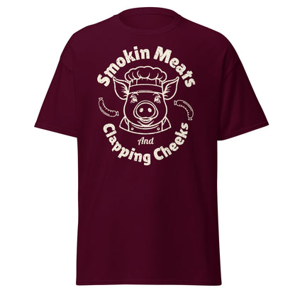 Maroon Smokin Meats pig chef barbecue T-shirt on plain white background.