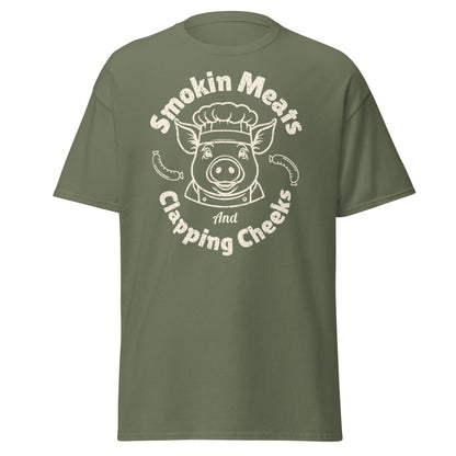 Military green Smokin Meats pig chef barbecue T-shirt on plain white background.