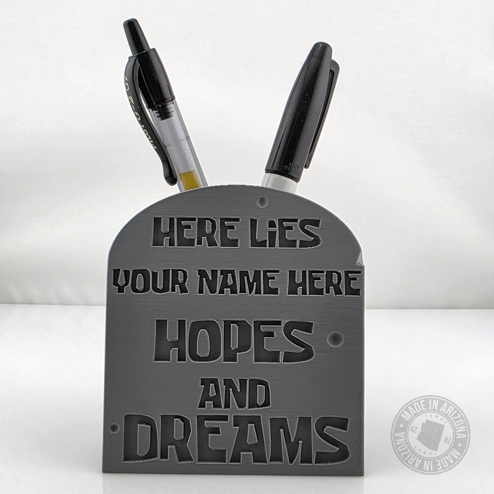 Gray tombstone desk pen holder with customizable hopes and dreams engraving.